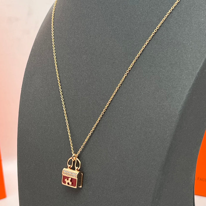 Hermès Amulettes Constance Pendant Necklace  
 Color:green / Black / red/ivory(rose gold tone)