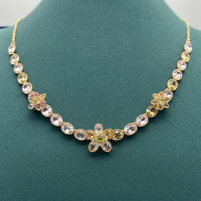 Name: Idyllia Floral Strand Necklace / Crystal Flower Line Necklace  
 Color: Gold-tone with soft pink, champagne, and green crystals