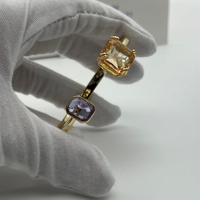 Swarovski Millenia Open Bangle / Dual Cut Crystal Cuff  
 Color: Gold-tone with light champagne/peach and pale lavender/lilac crystals
