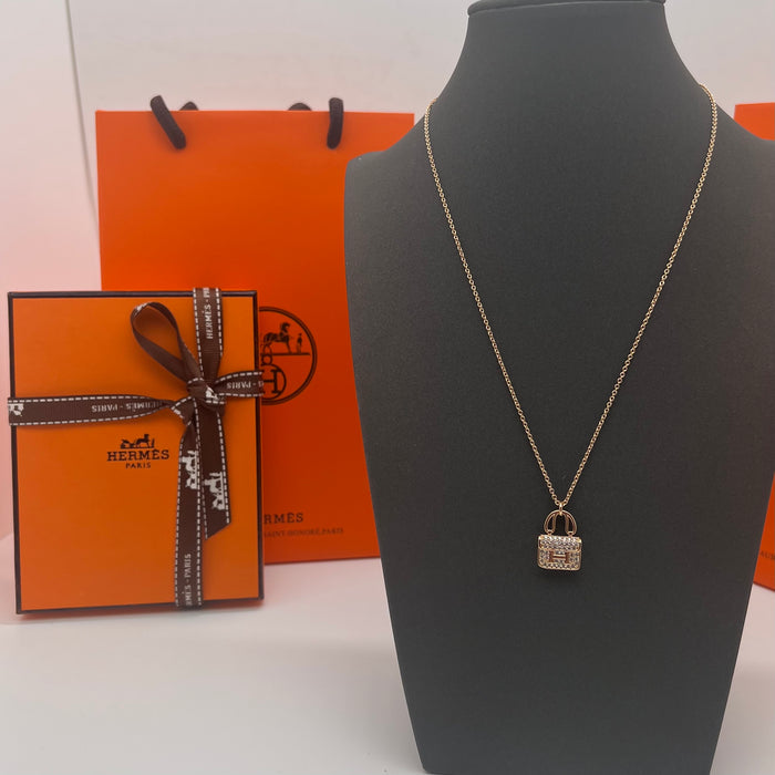 Name: Hermès Amulettes Constance Pendant / Necklace  
 Color: Gold / rose gold/silver
