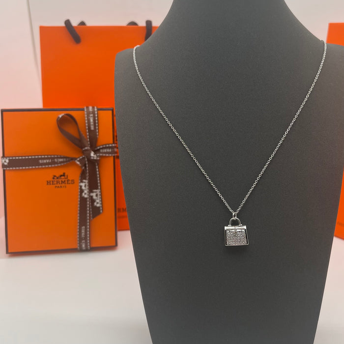 Hermès Amulettes Kelly Pendant Necklace  
 Color: Rose Gold/gold/silver