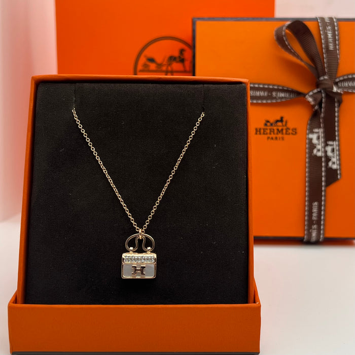 Hermès Amulettes Constance Pendant Necklace  
 Color:green / Black / red/ivory(rose gold tone)