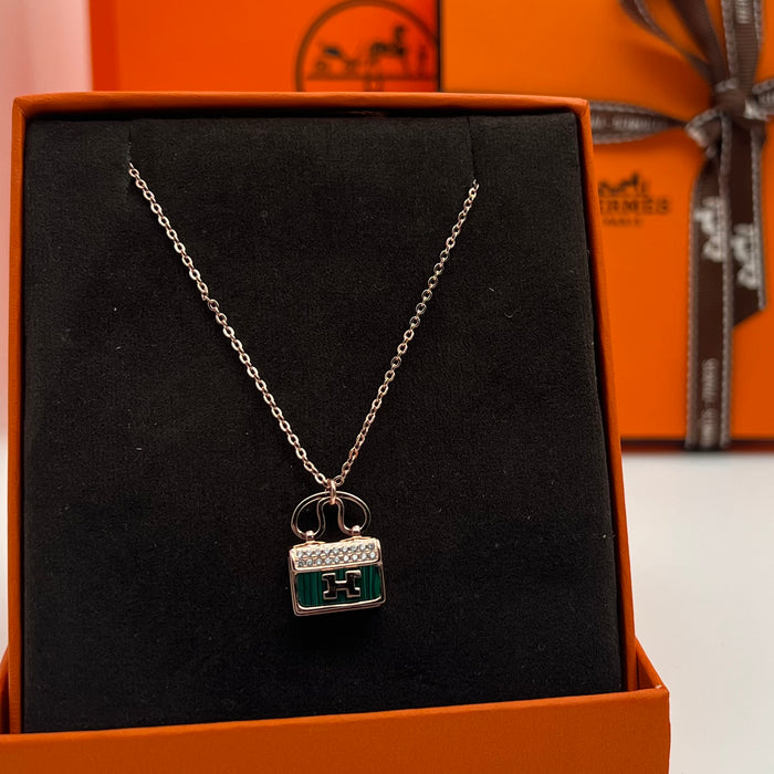Hermès Amulettes Constance Pendant Necklace  
 Color:green / Black / red/ivory(rose gold tone)