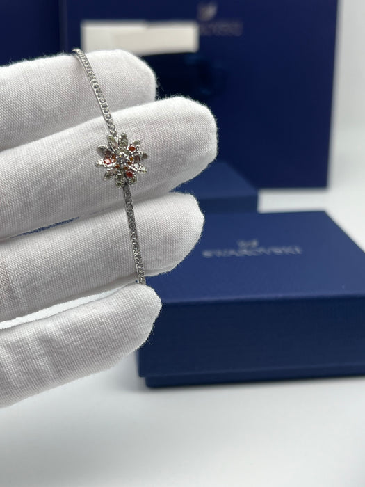 Swarovski Sunshine / Eternal Flower / Daisy Motif Bangle  
 Color: Silver, white, and warm tones (featuring clear and orange/peach crystals