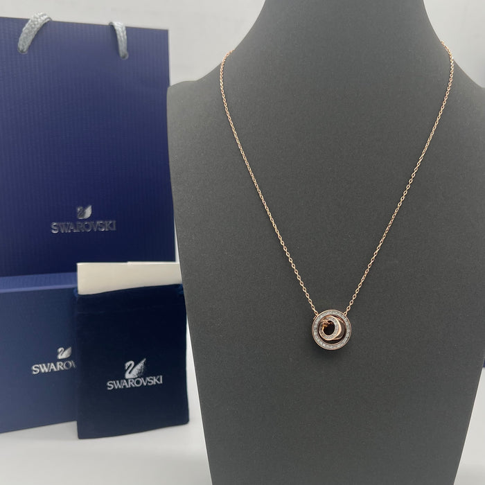 Swarovski Infinity / Twist / Generation Pendant Necklace  
 Color: Rose Gold and Clear