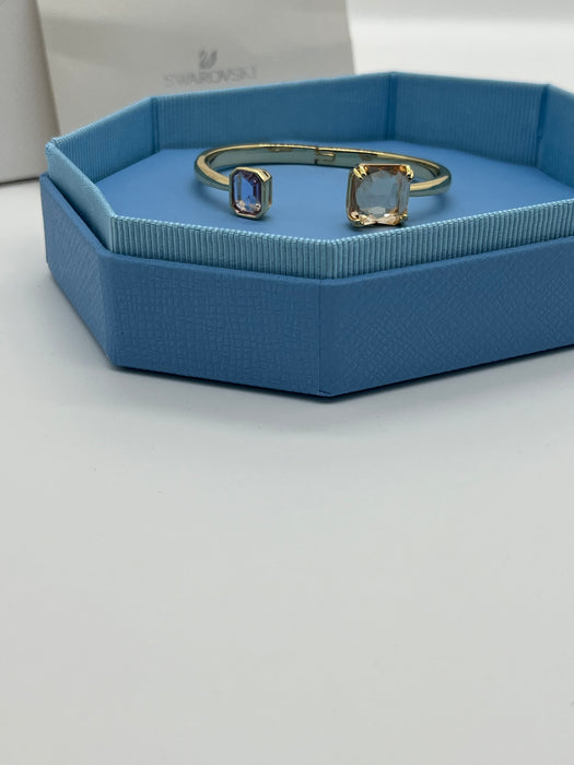 Swarovski Millenia Open Bangle / Dual Cut Crystal Cuff  
 Color: Gold-tone with light champagne/peach and pale lavender/lilac crystals
