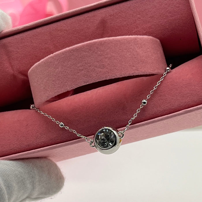 Swarovski Crystal Station Bracelet  
 Color: Silver with a Clear Pavé-Framed Crystal