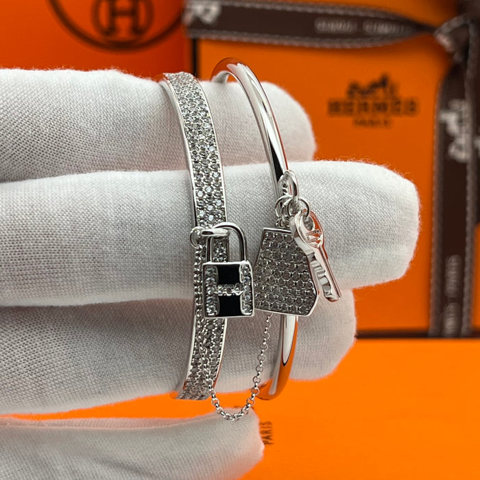 Hermès  double Kelly Clochette / Lock  Bangle Bracelet  
 Color: Silver / with clear pavé crystals/diamonds