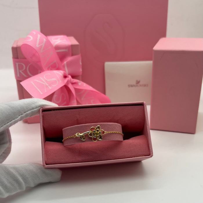 Swarovski Idyllia Single Flower & Stem Chain Bracelet  
 Color: Gold-tone with multicolored crystals (featuring pink, brown, olive green, and clear stones