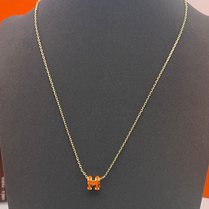 Name: Hermès Pop H Pendant Necklace  
 Color: orange (gold tone)
