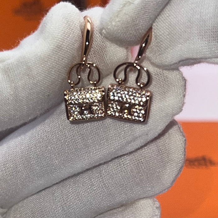 Hermès Amulettes Constance Earrings / Mini Constance Drop Earrings  
 Color: Silver, Gold, and Rose Gold finishes