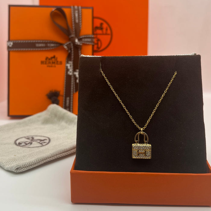 Name: Hermès Amulettes Constance Pendant / Necklace  
 Color: Gold / rose gold/silver