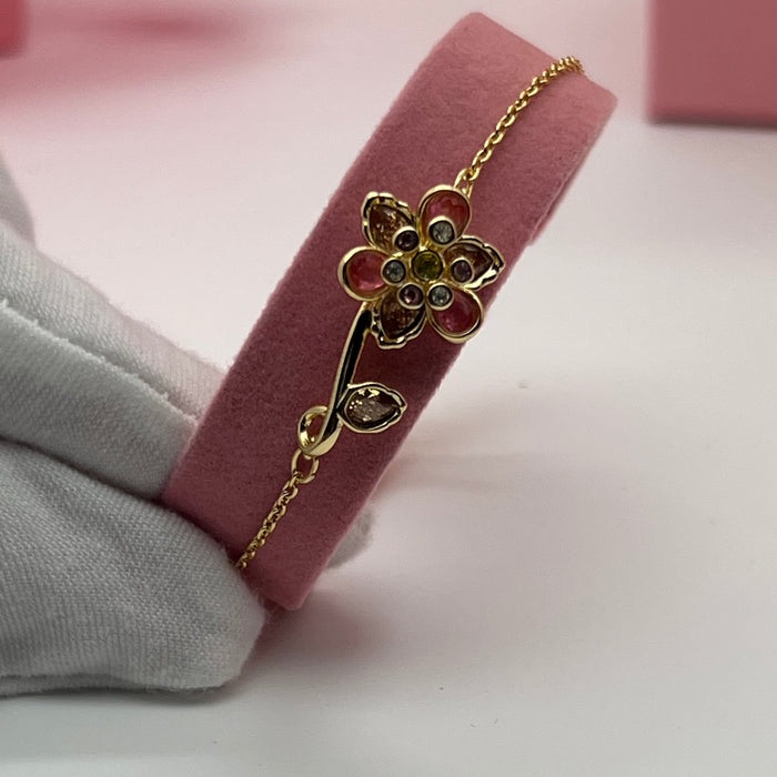 Swarovski Idyllia Single Flower & Stem Chain Bracelet  
 Color: Gold-tone with multicolored crystals (featuring pink, brown, olive green, and clear stones