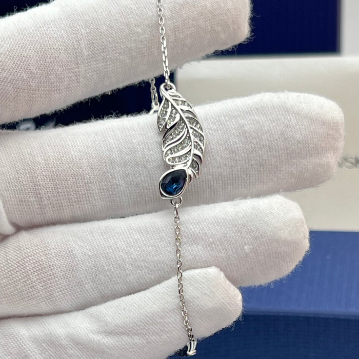 Swarovski Nice Feather Station Bracelet  
 Color: Silver and Dark Blue with Clear Pavé Crystals