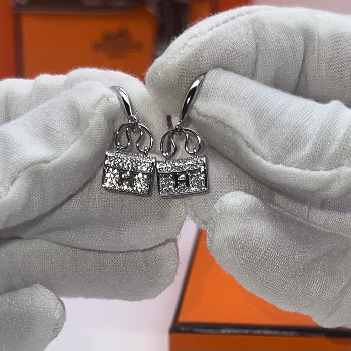 Hermès Amulettes Constance Earrings / Mini Constance Drop Earrings  
 Color: Silver, Gold, and Rose Gold finishes