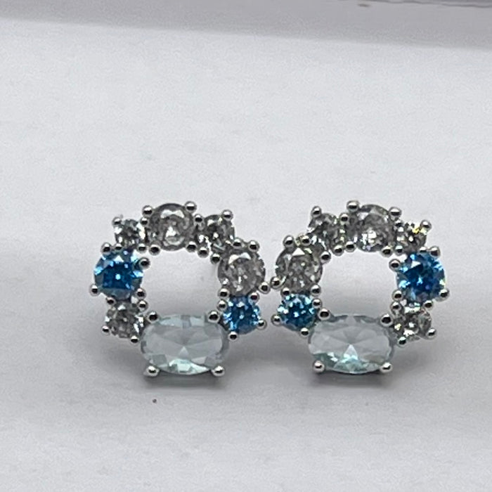 Swarovski Floral Open Circle / Wreath Stud Earrings  
 Color: Silver, light blue, and clear