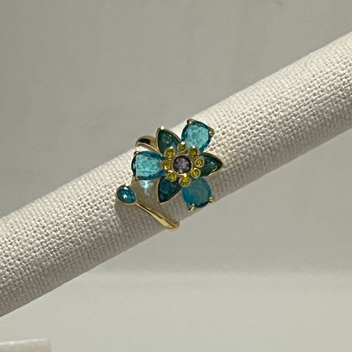 Swarovski Idyllia Blue Flower Ring 
 Color: Vibrant turquoise blue with a central purple crystal and yellow accent crystals (Left) / Shades of green, olive, and yellow with small pink crystal accents (Right