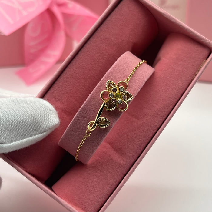 Swarovski Idyllia Single Flower & Stem Chain Bracelet  
 Color: Gold-tone with multicolored crystals (featuring pink, brown, olive green, and clear stones