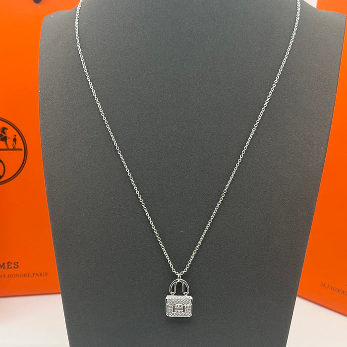 Name: Hermès Amulettes Constance Pendant / Necklace  
 Color: Gold / rose gold/silver