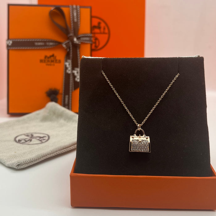 Hermès Amulettes Kelly Pendant Necklace  
 Color: Rose Gold/gold/silver