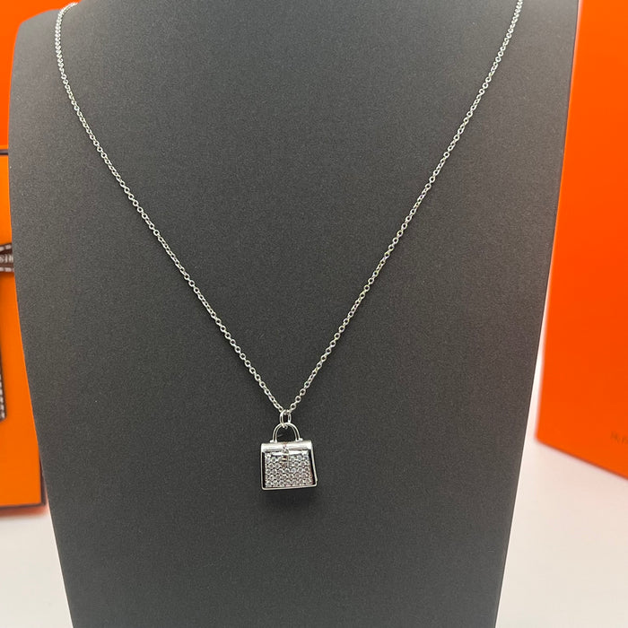 Hermès Amulettes Kelly Pendant Necklace  
 Color: Rose Gold/gold/silver