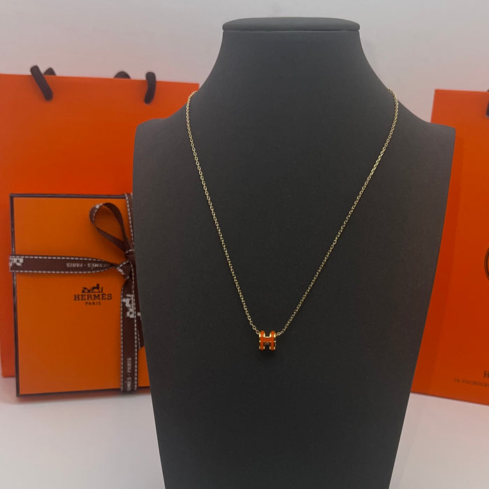 Name: Hermès Pop H Pendant Necklace  
 Color: orange (gold tone)