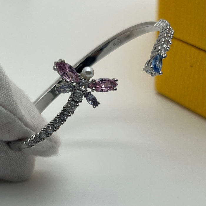 Swarovski Idyllia Butterfly & Pearl Open Bangle / Crystal Insect Cuff  
 Color: Silver-tone with pink, white (crystals and crystal pearl), and pale blue stones