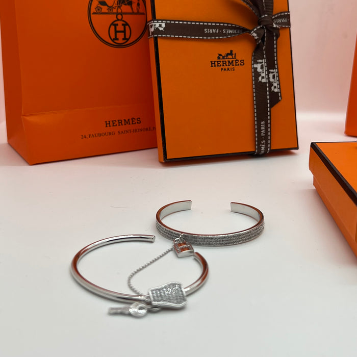 Hermès  double Kelly Clochette / Lock  Bangle Bracelet  
 Color: Silver / with clear pavé crystals/diamonds