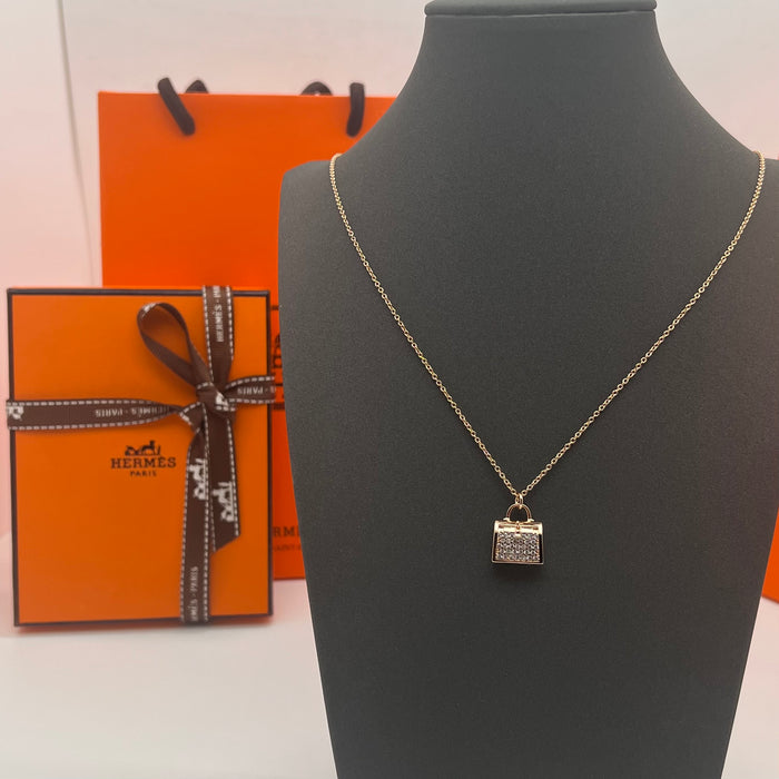 Hermès Amulettes Kelly Pendant Necklace  
 Color: Rose Gold/gold/silver