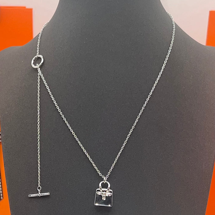 Hermès Amulettes Kelly Pendant Necklace  
 Color: Silver