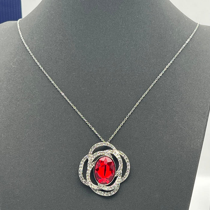 Swarovski Eternal Flower / Florere Pendant 
 Color: Silver, Clear, and Ruby Red/Midnight Blue