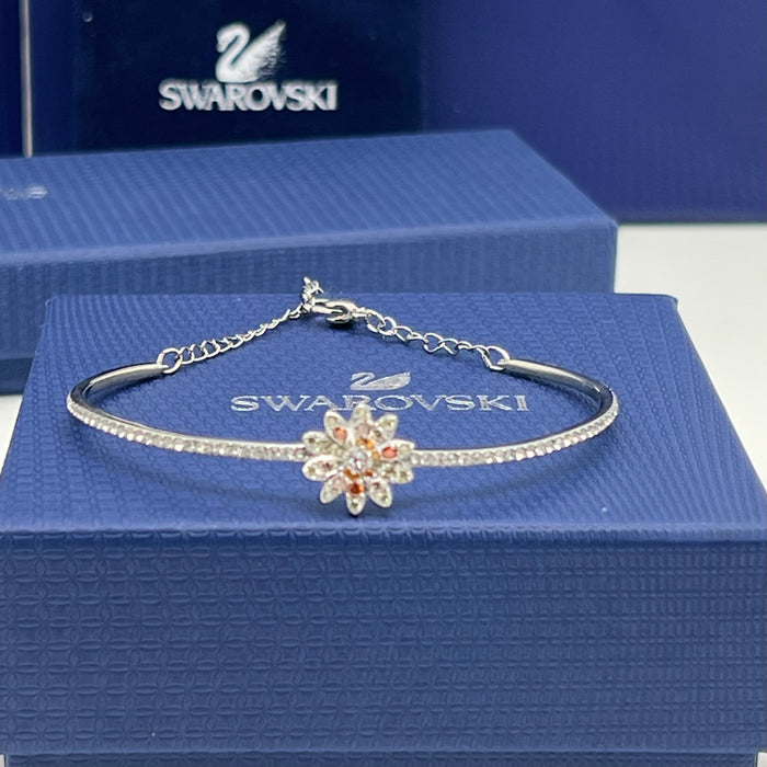 Swarovski Sunshine / Eternal Flower / Daisy Motif Bangle  
 Color: Silver, white, and warm tones (featuring clear and orange/peach crystals