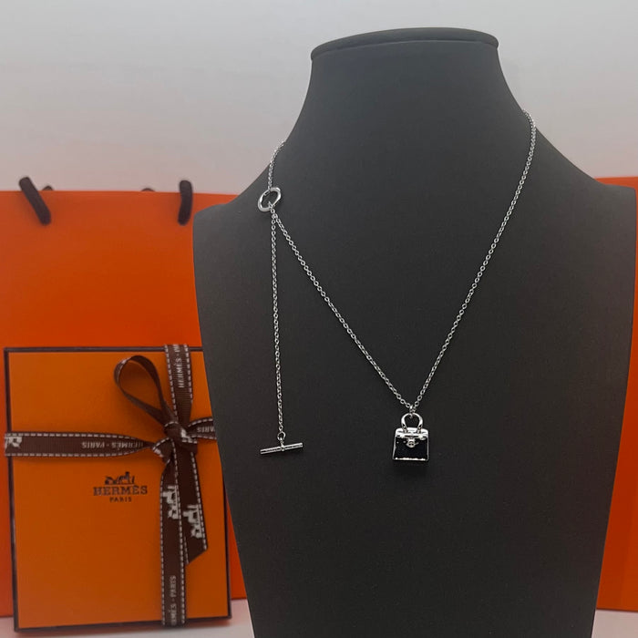Hermès Amulettes Kelly Pendant Necklace  
 Color: Silver