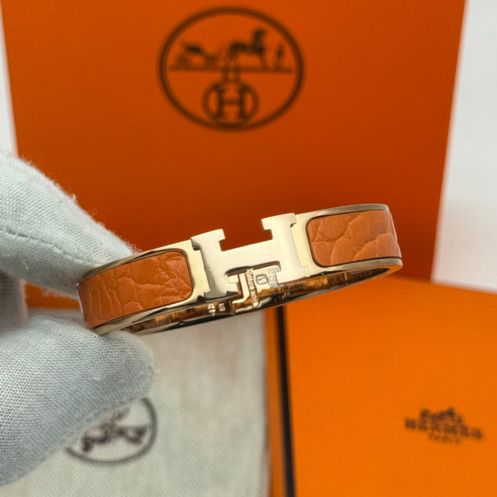 Hermès Clic H Leather Bracelet – Gold & Rose Gold Tone