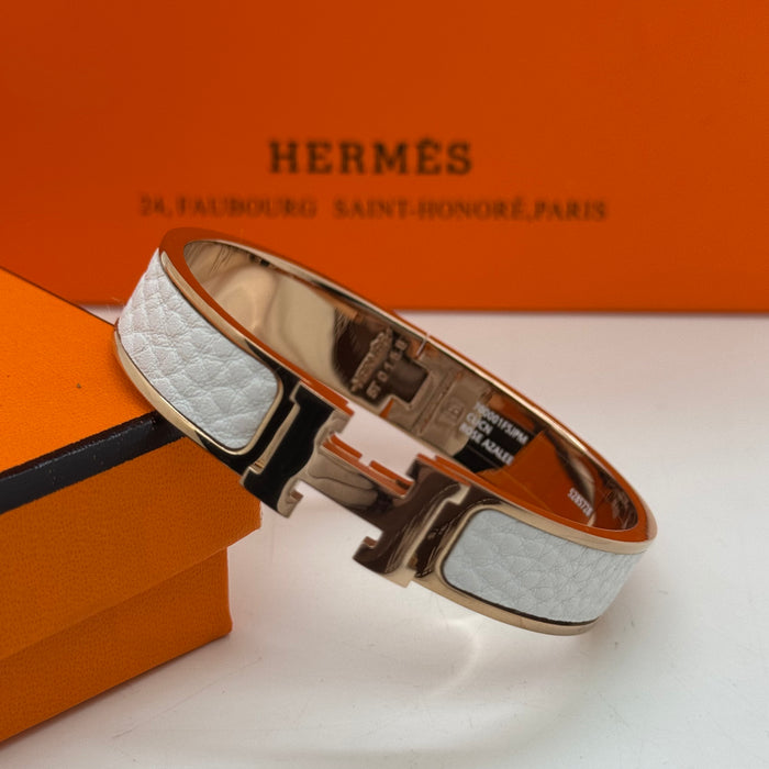 Hermès Clic H Leather Bracelet – Gold & Rose Gold Tone
