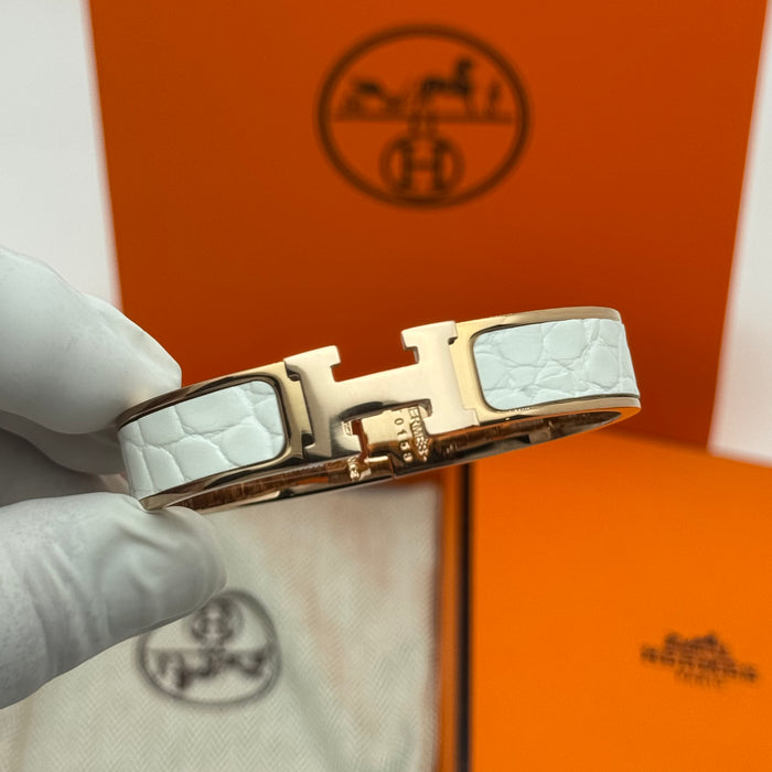 Hermès Clic H Leather Bracelet – Gold & Rose Gold Tone