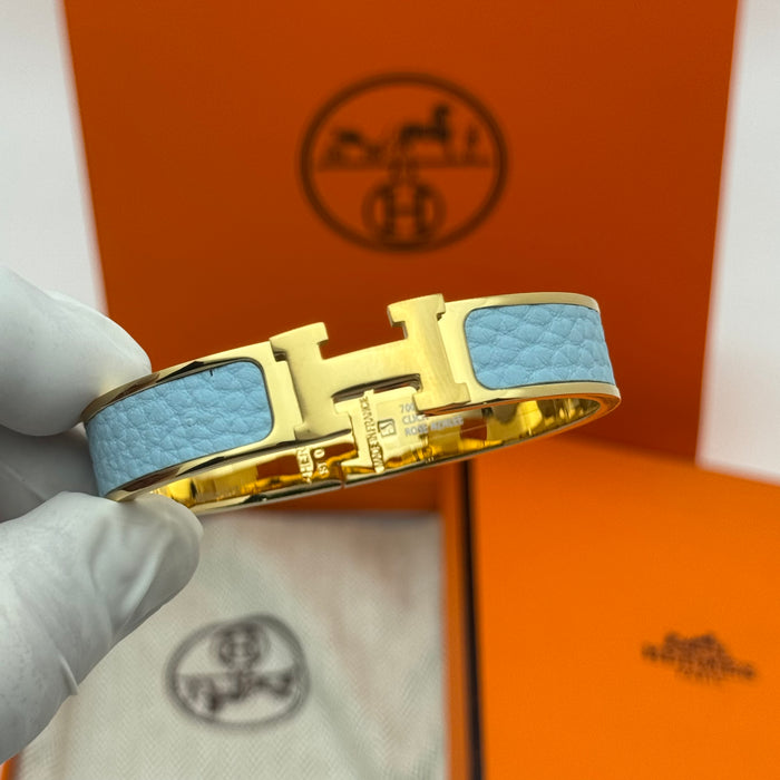 Hermès Clic H Leather Bracelet – Gold & Rose Gold Tone