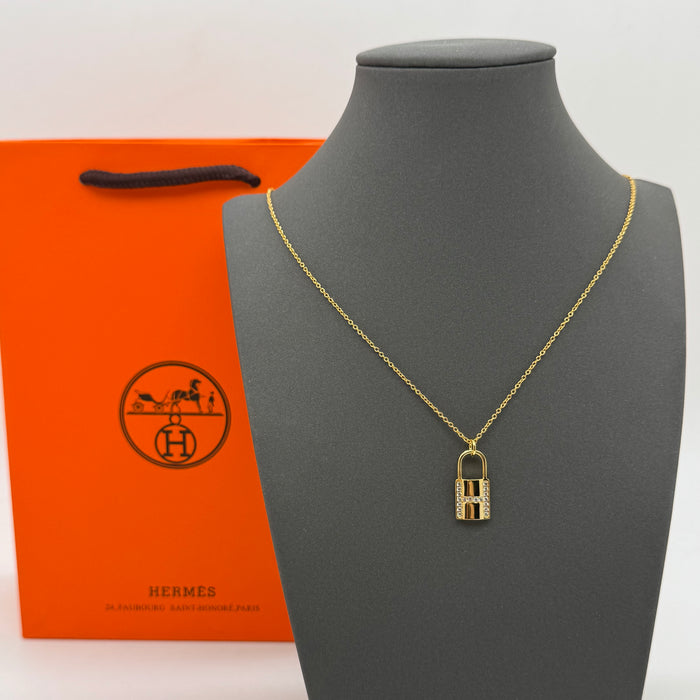 Hermès Kelly Lock Necklace in Gold-Silver & Rose Gold with Crystal “H” Pendant